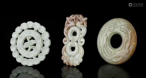 A GROUP OF THREE (3) JADE CARVINGS China The first one is an...