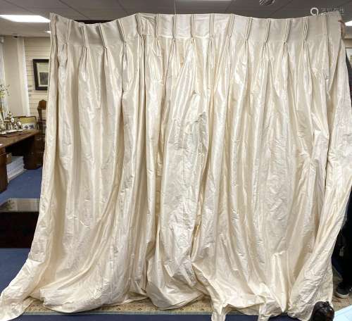 A large pair of cream satin curtains. 100 inches drop