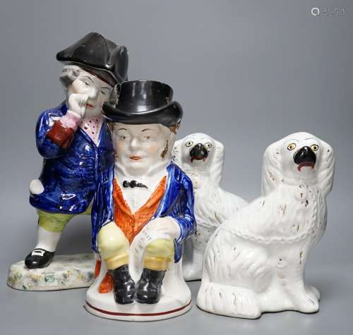 Two Staffordshire Toby jugs and a pair of Kings Charles Span...