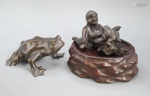A Chinese bronze group of Liu Hai and a toad, wood stand and...