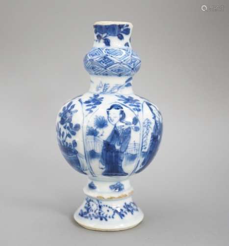 A Chinese Kangxi blue and white garlic neck vase, rim reduce...