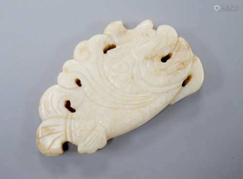 A Chinese white and black jade ‘dragon-fish’ plaque, 19th/20...