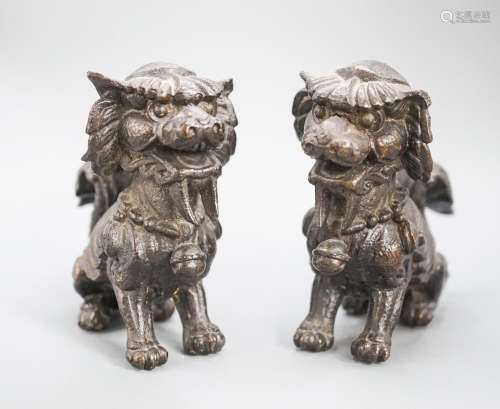 A pair of South East Asian bronze figures of Buddhist lions ...