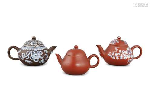 A GROUP OF THREE (3) YIXING TEAPOTS China, 20th century The ...