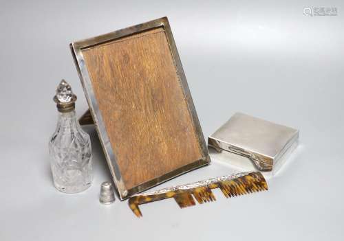 A silver mounted cigarette box, a silver mounted photograph ...