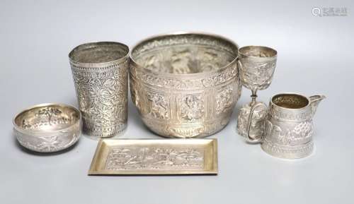 A group of Indian items including a white metal bowl embosse...