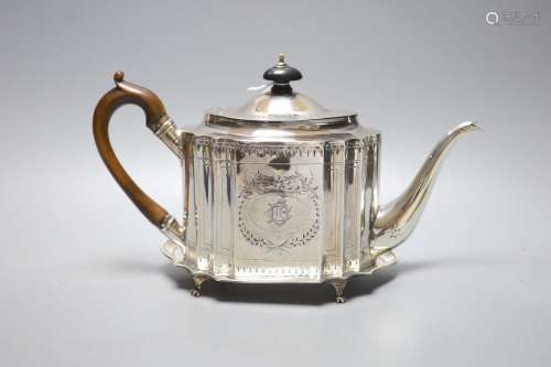 A George III bright cut engraved oval teapot and matching st...