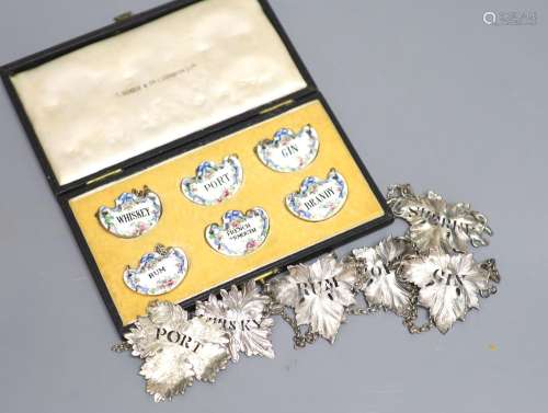 A set of four Victorian silver leaf shaped wine labels, Lond...