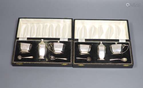 Two modern cased three piece silver condiment sets,