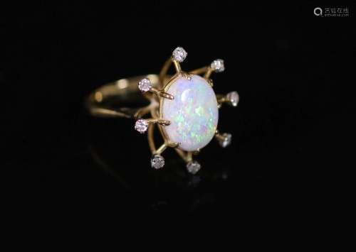 An 18ct gold, single stone oval white opal and eight stone d...