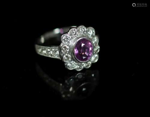 A modern 18ct white gold, pink sapphire and diamond cluster ...