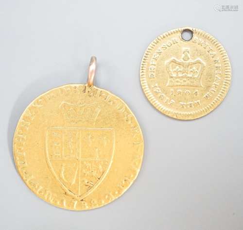 A George III 1788 gold guinea, now with pendant loop and an ...