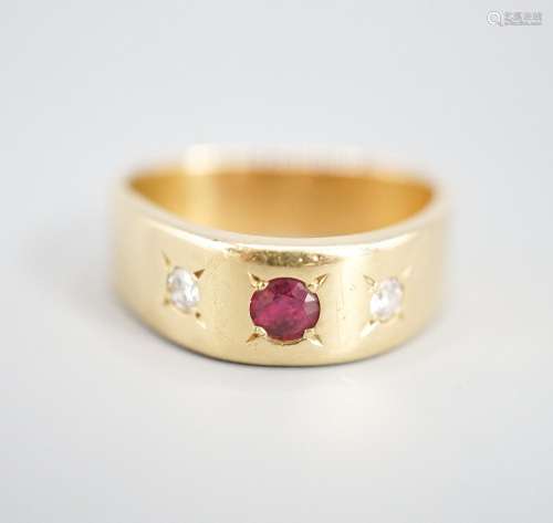 An 18ct and gypsy set three stone ruby and diamond ring, of ...