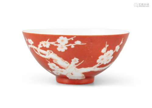 A RESERVE DECORATED CORAL GROUND ‘PLUM BLOSSOMS’ PORCELAIN B...