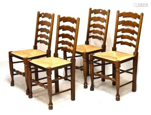 Four ladder-back rush seated dining chairs