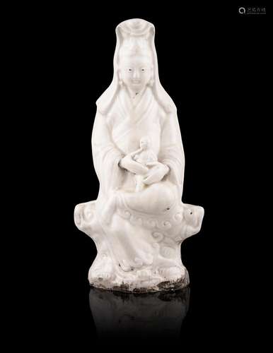 A DEHUA / BLANC DE CHINE MOLDED PORCELAIN MODEL OF GUANYIN W...