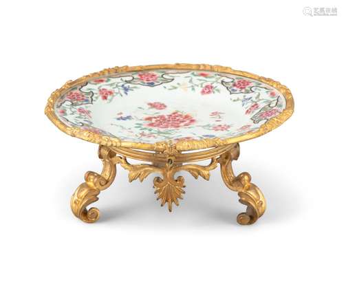 AN ORMOLU MOUNTED CHINESE EXPORT ‘FLOWER’ PORCELAIN PLATE Th...