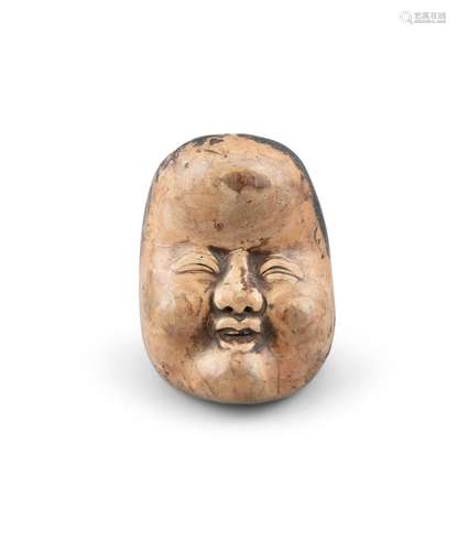 A WOOD NETSUKE OF OKAME Japan, 19th century Shaped as a face...