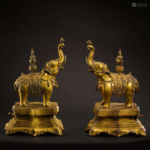 A PAIR OF GILDED CHINESE BRONZE STATUES FROM THE QING DYNAST...