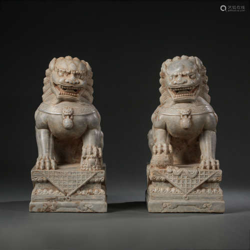 A PAIR OF CHINESE MING DYNASTY STONE LIONS