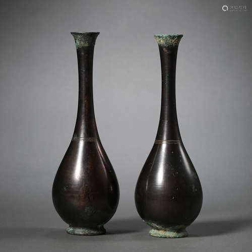 A PAIR OF CHINESE TANG DYNASTY COPPER BOTTLES