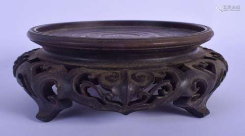 A 19TH CENTURY CHINESE CARVED HARDWOOD STAND Late Qing, form...