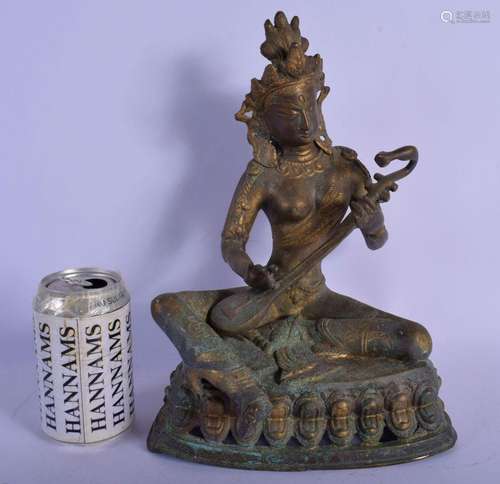 A 19TH CENTURY INDIAN BRONZE FIGURE OF A SEATED BUDDHA model...