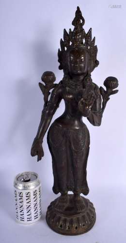 A LARGE LATE 19TH CENTURY CHINESE BRONZE FIGURE OF A STANDIN...