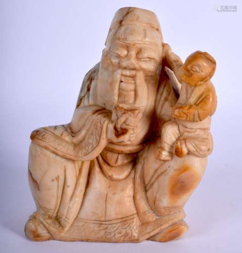 AN EARLY 18TH CENTURY CHINESE STONE FIGURE OF A SEATED IMMOR...