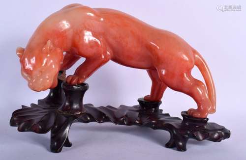 A CHINESE AGATE STYLE MODEL OF LION 20th Century. 30 cm x 22...