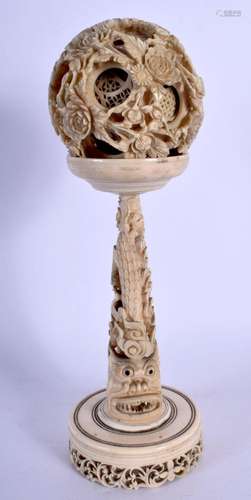 A 19TH CENTURY CHINESE CANTON IVORY PUZZLE BALL ON STAND Qin...