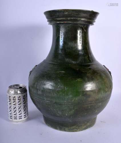 A CHINESE HAN DYNASTY STONEWARE FUNERY GREEN GLAZED JAR with...