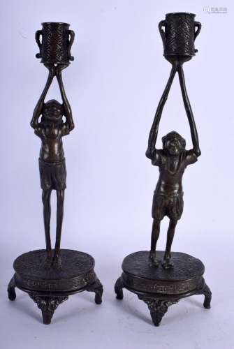 A RARE PAIR OF 19TH CENTURY JAPANESE BRONZE FIGURAL CANDLEST...