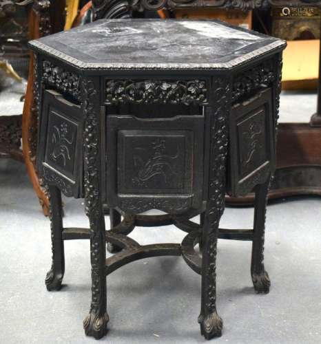 A 19TH CENTURY CHINESE HEXAGONAL HARDWOOD TABLE WITH CARVED ...