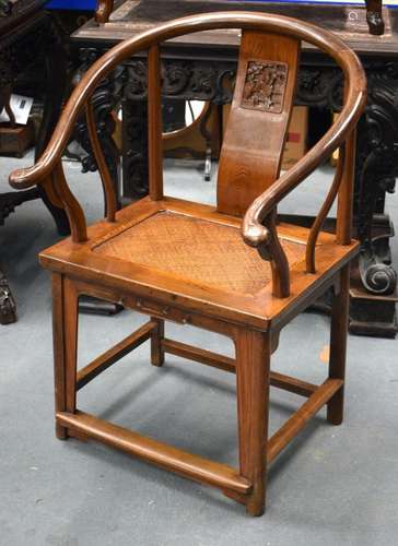 AN EARLY 20TH CENTURY CHINESE HARDWOOD HORSESHOE BACKED ARMC...