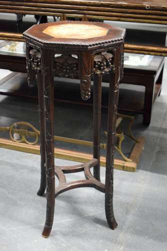 A 19TH CENTURY CHINESE MARBLE INSET HARDWOOD TABLE WITH FLOR...