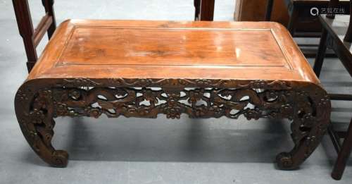 A 19TH CENTURY CHINESE HARDWOOD LOW FORM OPIUM TABLE WITH A ...