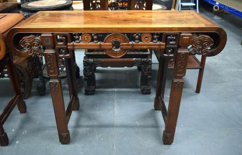 A 19TH CENTURY CHINESE HARDWOOD ALTAR TABLE WITH A CARVED LI...