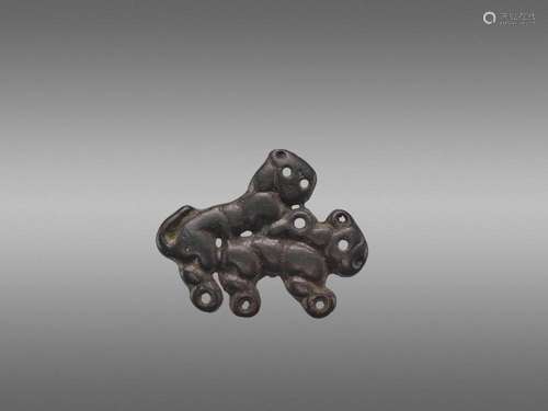 AN ORDOS BRONZE ‘COPULATING TIGERS’ PLAQUE, WARRING STATES