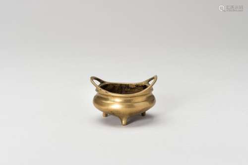 A MINIATURE BRONZE TRIPOD CENSER