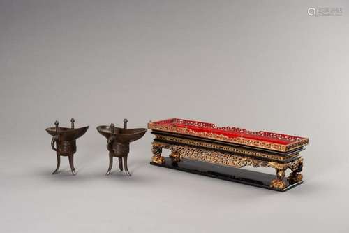 A RARE PAIR OF ARCHAISTIC BRONZE JUE QIANLONG MARK AND PERIO...