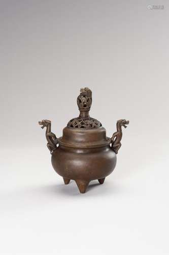 A BRONZE TRIPOD CENSER WITH DRAGONS