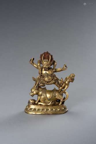 A TIBETAN GILT BRONZE FIGURE OF YAMA DHARMARAJA