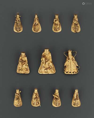 A SET OF ELEVEN GILT SILVER REPOUSSÉ HEADDRESS ORNAMENTS, QI...