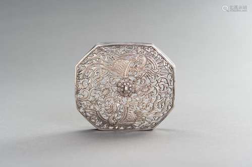 A RETICULATED SILVER LID WITH PHOENIXES