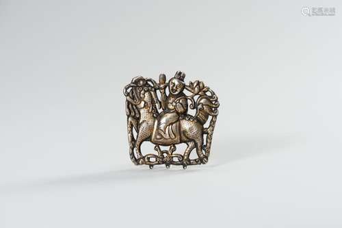 A PARCEL GILT SILVER REPOUSSÉ ORNAMENT OF GUANYIN ON A BUDDH...