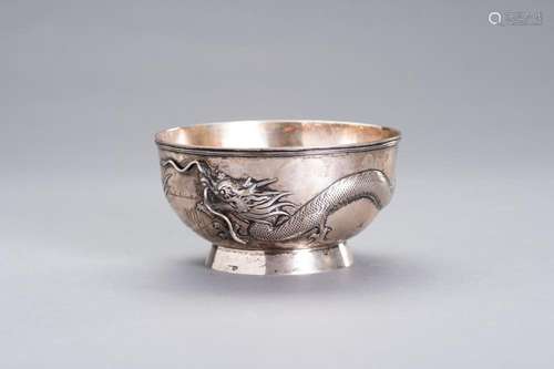 A SILVER REPOUSSE `DRAGON´ BOWL