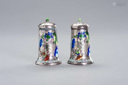 AN ENAMELLED SILVER SALT AND PEPPER SHAKER SET