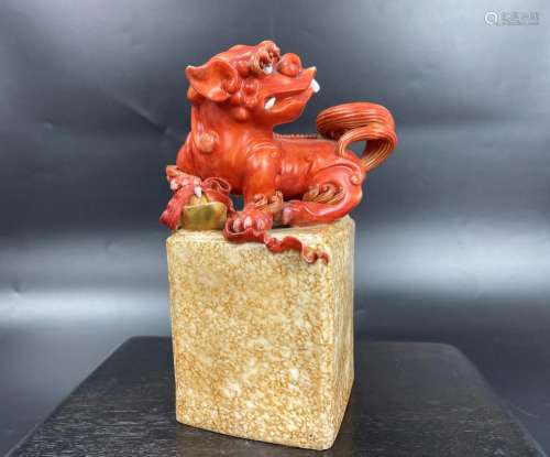A Chinese Iron Red Glaze Porcelain Lion Statue