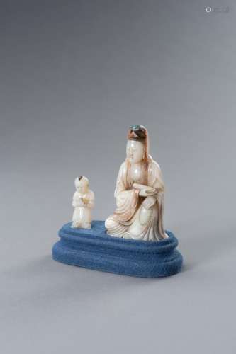 A SOAPSTONE GROUP OF GUANYIN WITH BOY